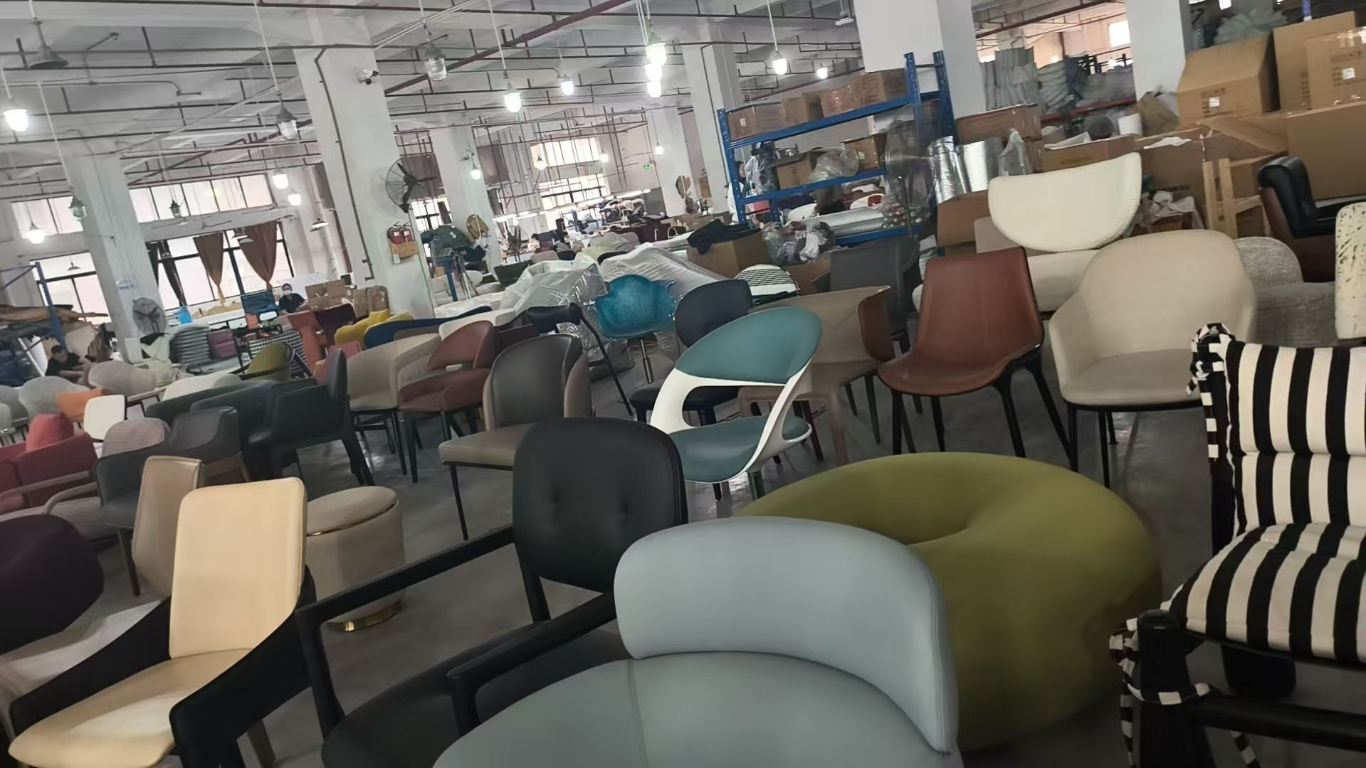 Client and Karsa reviewing finished furniture in factory showroom during supplier verification visit